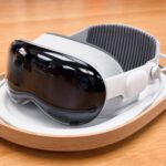 A sleek and modern virtual reality headset on a wooden surface.